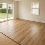 The image features a neutral art deco living room with tints of gold and yellow gold. It has an L-shaped seating area feat...